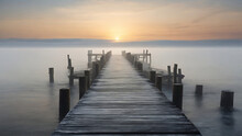 Wooden Pier At Misty Dawn In A Still Sea With Winter Smoke, Generative AI