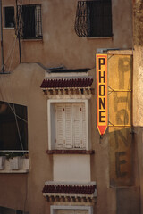 Canvas Print - Phone sign on a residential building in Sousse city, Tunisia