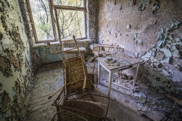 Wall Mural - Cribs in maternity ward of Hospital MsCh-126 in Pripyat ghost city in Chernobyl Exclusion Zone, Ukraine