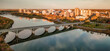 Bridge over Saskatchewan River with city in background. Saskatoon, SK, Canada
