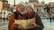 Happy elderly couple in love travelling around the world with map in hand, secured old age, adventure, tourism
