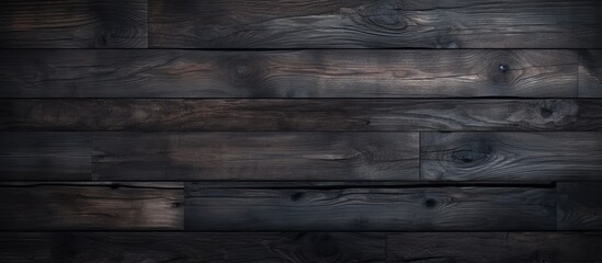 Wall Mural - A close up of a dark hardwood flooring with a blurred background, showcasing a brown rectangle pattern in the darkness