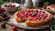 Delicious cherry pie on the table next to a fresh berries cut slice