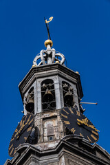 Poster - Fragment of Amsterdam Mint Tower (or Munttoren, 1620) at Muntplein square near flower market. Munttoren was originally part of gate in Amsterdam's medieval city wall. Amsterdam, the Netherlands.