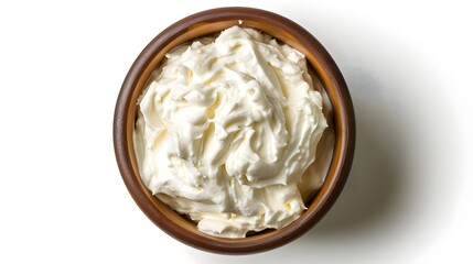 Sour cream in a bowl top view isolated on white background