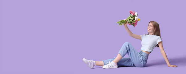 Sticker - Happy young woman with bouquet of beautiful tulips sitting against lilac background