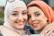 © Santi Nuñez/Stocksy - Portrait of happy muslim women friends