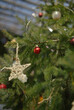 © Anna Malgina/Stocksy - Christmas tree decoration on a natural tree