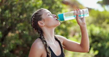 Wall Mural - Woman, relax and workout in nature with drinking water for hydration, tired and deep breathing with fitness. Runner, athlete or liquid break for exercise, running or training outdoor for healthy body