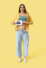 Sticker - Young pregnant woman with sonogram image on yellow background