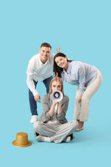 Poster - Business people with megaphone making horns on blue background. April Fools' Day celebration