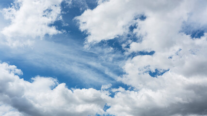 Wall Mural - background of blue sky with fluffy white clouds