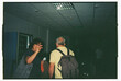 © Tessy Morelli/Stocksy - Waving goodbye at the airport terminal