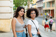 © Daniel Zapata/Stocksy - Portrait of two young women on the street.