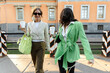© Nikita Sursin/Stocksy - Two young women walking in the summer city