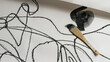 © Jessa Shwayder Carta/Stocksy - Detail of charcoal abstract art with a paintbrush.