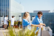 © BONNINSTUDIO/Stocksy - Medical team during conversation on hospital terrace