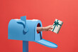 © Marc Tran/Stocksy - Human hand is taking out a gift box from a mailbox