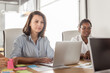 © Camelia Elisabeta Utalea/Stocksy - diverse, multiracial group in a coworking office