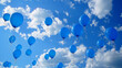 Azure blue balloons floating gracefully against a holiday sky, creating an atmosphere of tranquility.