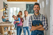 © Degimages - A homeowner dressed in work clothes proudly showcasing their completed DIY finished project in home interior design, woman and children around him.