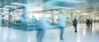 A motion blurred photograph of a hospital interior, doctor and staff working with fast movement