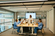 © BONNINSTUDIO/Stocksy - Female doctor having a presentation to medical colleagues