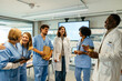 © BONNINSTUDIO/Stocksy - Healthcare workers having a meeting at hospital