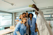 © BONNINSTUDIO/Stocksy - Healthcare workers having a meeting at hospital