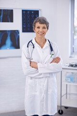 Poster - Senior doctor, woman and arms crossed in portrait, radiology for surgery with anatomy scan and healthcare. Medical professional, treatment and surgeon in room for xray, medicine and confident expert