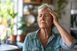 Dizziness or headache of Caucasian senior woman.