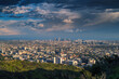 City of Los Angeles cityscape panorama after storm. Downtown LA skyline shot at sunset from Hollywood Hills.