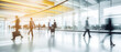 © ND STOCK - Business people walk in a large office lobby against a cityscape background. Motion blur effect, bright business workplace with people in walking in blurred motion in modern office space