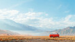 Vintage red van on a desert road with breathtaking mountain backdrop under a blue sky.