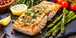 Succulent grilled salmon, seasoned with herbs and zesty lemon, accompanied by charred green asparagus on a slate background