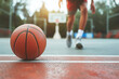 Close up basketball player playing basketball at the sport ground , sportsman with a ball over basketball background