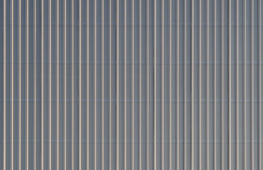 Wall Mural - perforated corrugated sheet metal, aluminum Facade of a warehouse as background texture