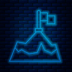 Poster - Glowing neon line Mountains with flag on top icon isolated on brick wall background. Symbol of victory or success concept. Goal achievement. Vector