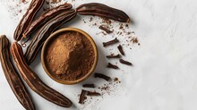 Locust Bean Nutritious Meal, Carob Molasses In A Glass Bowl and Carob Flour Or Powder With Carob Pods On A White Background And Space For Text, Generative AI.