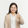 © LightCapturer - Happy smiling young Asian female teacher in a cardigan and white shirt
