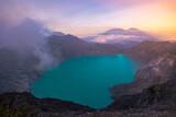 Fototapeta Sawanna - sunrise over the mountains at Ijen lake on Java