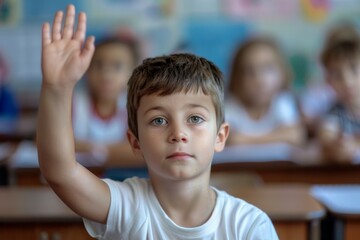 Wall Mural - A boy in a classroom raises his hand