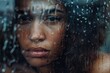 © steevy84 - Beautiful young woman behind a wet window at a rainy day. Waterpdrops on the window. The woman is sad.