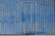 a blue door in a blue wall