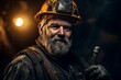 © Maria - A miner in a helmet and work clothes, with a beard and a dirty face, stands in a mine and looks at the camera