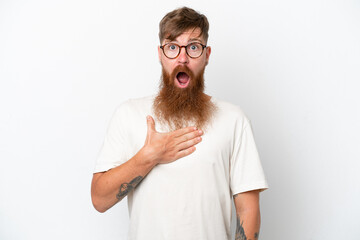 Wall Mural - Redhead man with long beard isolated on white background surprised and shocked while looking right