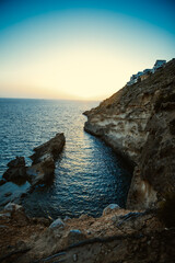 Canvas Print - Scenic view of a rocky coastline at sunset