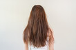 © Pormezz - Back view of long hair Young woman have problem with dyed hair and damaged.