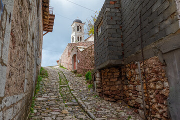 Wall Mural - Street view of Dimitsana village in Arcadia, Peloponnese, Greece. Narrow cobblestone alleys.