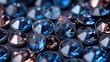 a bunch of blue diamonds sitting on top of a pile of other blue and white diamonds on top of a table.